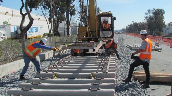 crews laying new BART track